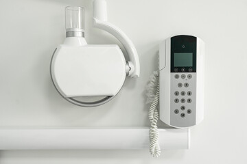 X-ray machine for dentists on white wall