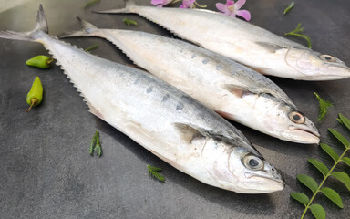 Selective focus of Doublespotted queenfishFish decorated on a wooden pad.
