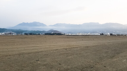 A large area of soil is free of grass