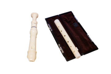 Alto recorder flute with a red case, closeup, isolated on a white background