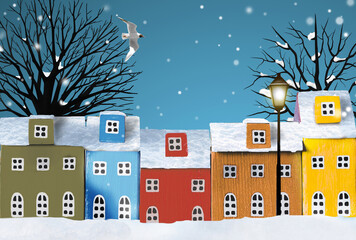 Row of wooden miniature colorful houses in winter snowy town