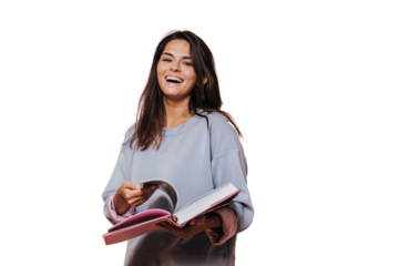 Beautiful girl in casual sweater with loose hair leafs open book on transparent background and laughing, Enjoying new book. Happy people concept. Beautiful young woman reading book. Candid emotions.