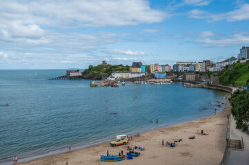 Fototapeta na wymiar View of Tenby's north beach, on a summers day. Tenby is located on the southern part of the Welsh coastal path