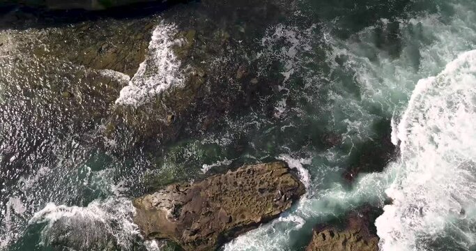 Seals and Seabirds pepper this aerial seascape footage over the rocky outcrops along the California coast