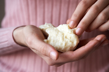 Woman holding raw shea butter or karite in her hands