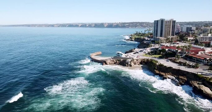 Aerial flight along the La Jolla coast approaching  the Children's Pool and sea wall