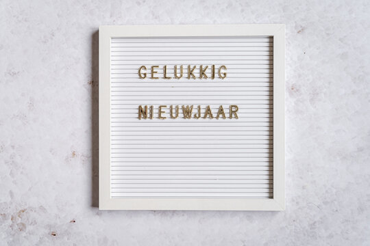 A white letterboard with Gelukkig Nieuwjaar (Dutch for Happy New Year)