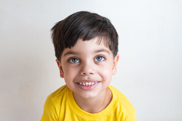 Cute and happy boy with yellow t-shirt