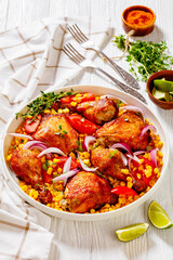 roast chicken with corn and tomatoes on plate