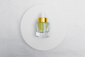 Trendy Beauty concept of Facial Serums, Natural Essential Oil in cosmetic bottles with dropper and bright sunligth shadow on white background.