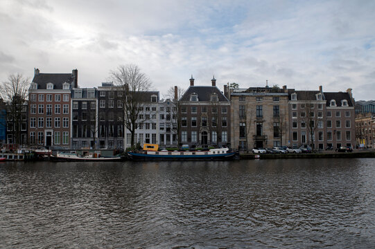 Canal Houses Along The Amstel River At Amsterdam The Netherlands 27-12-2022