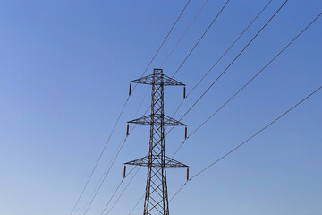 Electrical Pylon.Also known as transmission towers.UK National Grid.On a clear blue sky.