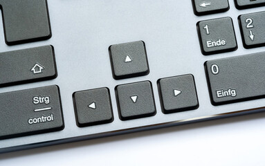 Simple modern office desktop PC, computer keyboard arrow keys, object detail, closeup. Arrows,...