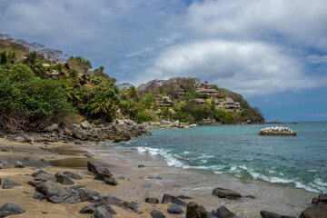 Los Muertos Beach, with hotels in the background on a sunny day in Sayulita, Mexico