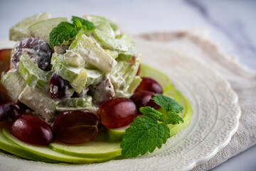 Traditional waldorf salad with apples, celery, walnuts, and grapes with a mayo dressing.
.