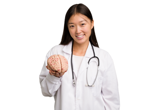 Young asian doctor woman holding a brain isolated happy, smiling and cheerful.