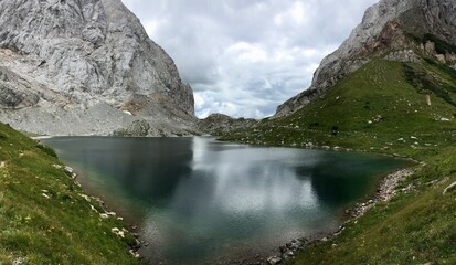 Naklejka na ściany i meble Volaia lake is an alpine lake in Carinthia, Austria, located near the homonymous pass, on the border with Italy (municipality of Forni Avoltri).