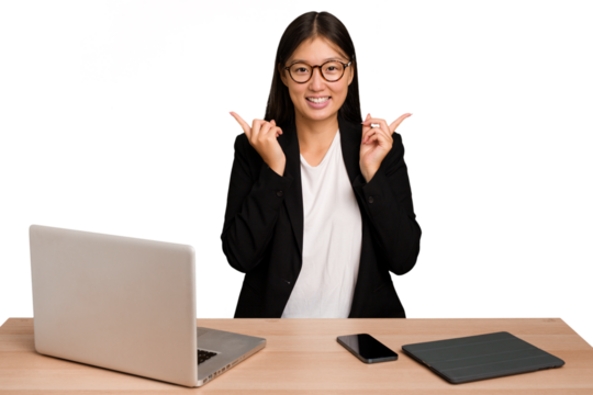 Young business asian woman sitting on a table isolated pointing to different copy spaces, choosing one of them, showing with finger.