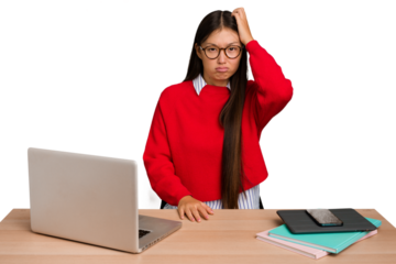 Young student asian woman in a workplace with a laptop isolated tired and very sleepy keeping hand on head.