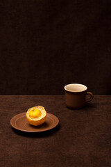 Still life with brown cups and lemon