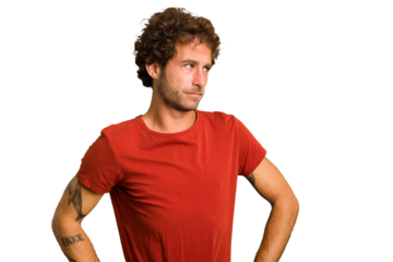 Young curly smart caucasian man cut out isolated confused, feels doubtful and unsure.