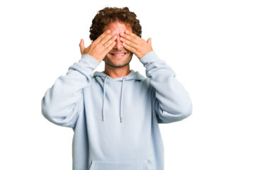 Young curly smart caucasian man cut out isolated afraid covering eyes with hands.