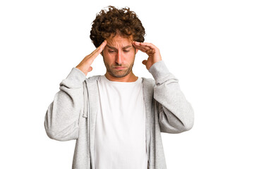 Young curly smart caucasian man cut out isolated touching temples and having headache.