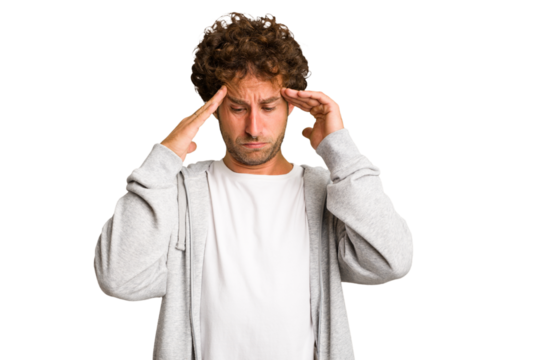 Young curly smart caucasian man cut out isolated touching temples and having headache.