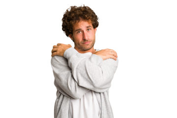 Young curly smart caucasian man cut out isolated hugs, smiling carefree and happy.