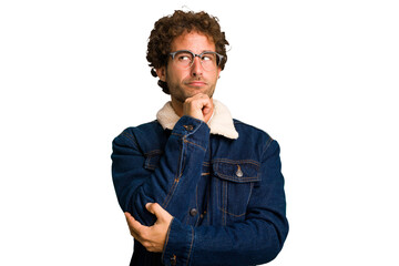 Young curly smart caucasian man cut out isolated looking sideways with doubtful and skeptical expression.