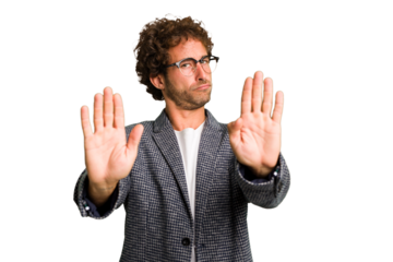 Young curly smart caucasian man cut out isolated standing with outstretched hand showing stop sign, preventing you.