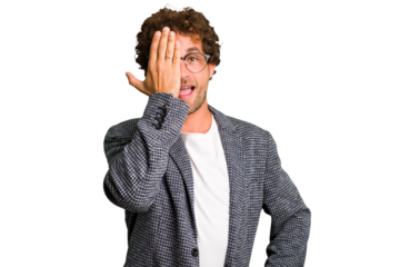 Young curly smart caucasian man cut out isolated having fun covering half of face with palm.