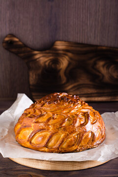 Traditional savory pie kurnik with chicken, potatoes and rice. Homemade baking. Vertical view