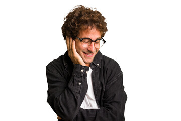 Obraz premium Young curly smart caucasian man cut out isolated laughs happily and has fun keeping hands on stomach.