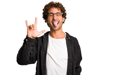 Young curly smart caucasian man cut out isolated showing rock gesture with fingers