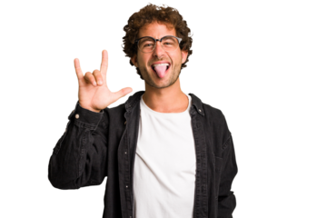 Young curly smart caucasian man cut out isolated showing rock gesture with fingers