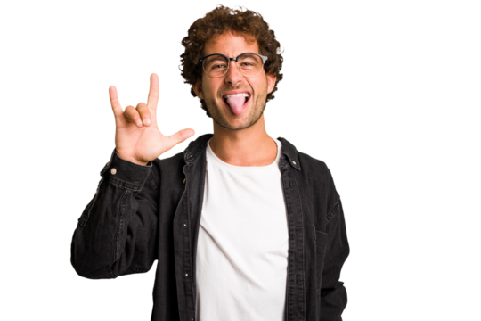 Young curly smart caucasian man cut out isolated showing rock gesture with fingers