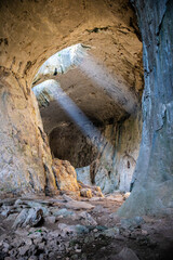 Light leaks, Light glare rays inside of a huge cave in Bulgaria Prohodna, 