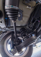 Bottom car view for safety inspection. Concept of garage services, used vehicle appraisal, car...