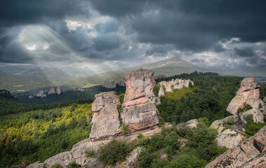 Dramatic sky mountains, rocky sandstone peaks mountain rocks, Belogradchik rocks Bulgaria