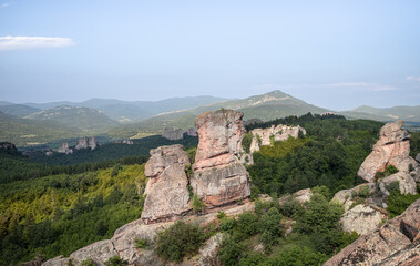 Sunny day, blue sky forests and rocky sandstone peaks mountain rocks, Belogradchik rocks