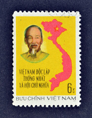 Cancelled postage stamp printed by Vietnam, that shows Ho Chi Minh and map of Vietnam, Unification of Vietnam, circa 1976.