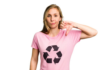 Young caucasian woman wearing a recycling t-shirt isolated showing a dislike gesture, thumbs down....