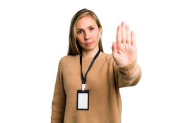 Young caucasian woman with ID card isolated standing with outstretched hand showing stop sign, preventing you.