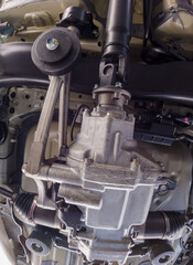 Bottom view of small car chassis and suspension. Rear suspension and differential of the vehicle...