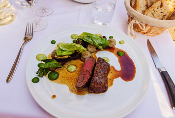 French cuisine plate restaurant view from above of delicious red meat and salad vegetables