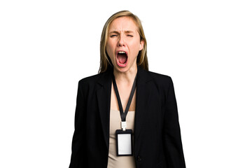 Young caucasian business woman with ID card isolated screaming very angry and aggressive.
