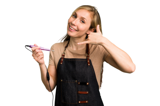 Young caucasian manicurist woman holding an electric file drill isolated showing a mobile phone call gesture with fingers. - Powered by Adobe