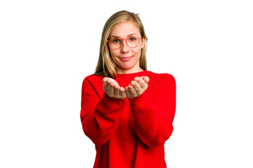 Young caucasian woman cutout isolated holding something with palms, offering to camera.