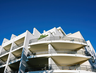 Low angle view of rounded balconies of an apartment building